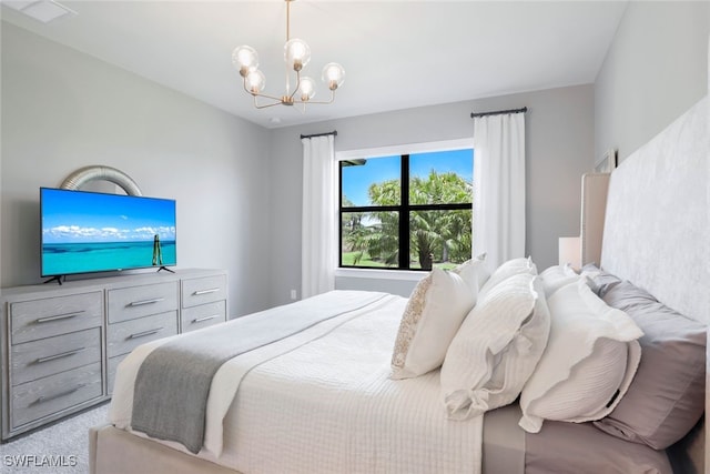 bedroom with light colored carpet and an inviting chandelier