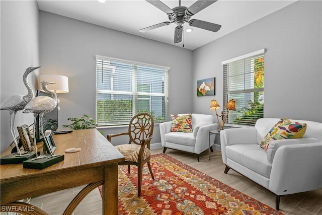 office area featuring ceiling fan and light wood-type flooring