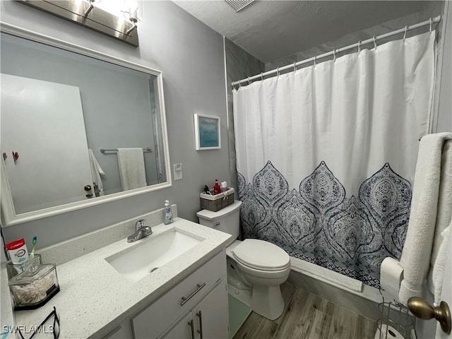 bathroom featuring vanity, wood-type flooring, toilet, and a shower with shower curtain