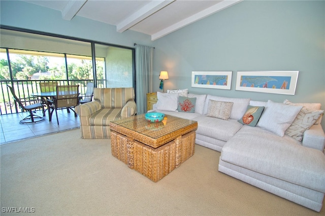 living room featuring beamed ceiling and carpet