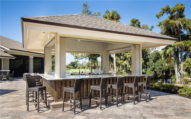 view of patio with a gazebo and exterior bar