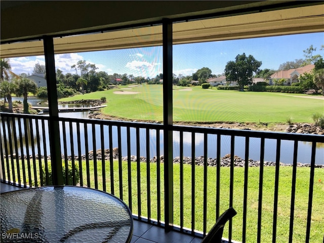 balcony featuring a water view