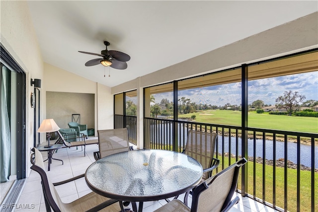 sunroom / solarium with vaulted ceiling, a water view, and ceiling fan