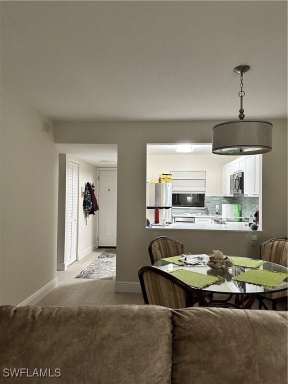 dining room featuring light hardwood / wood-style floors