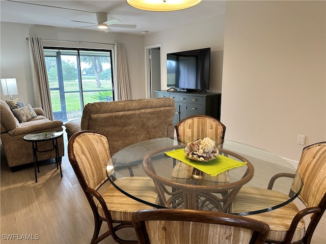 dining room featuring light hardwood / wood-style flooring and ceiling fan