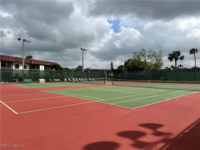 view of sport court featuring basketball hoop