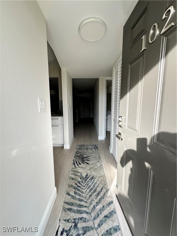 hall featuring dark hardwood / wood-style floors