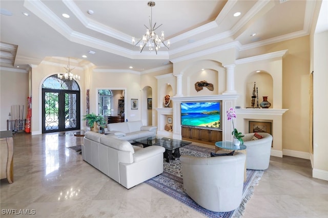 living room with crown molding, a tray ceiling, and french doors