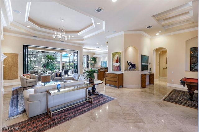 living room featuring an inviting chandelier, ornamental molding, billiards, and a tray ceiling