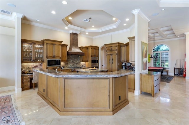 kitchen with tasteful backsplash, stainless steel oven, premium range hood, crown molding, and black microwave