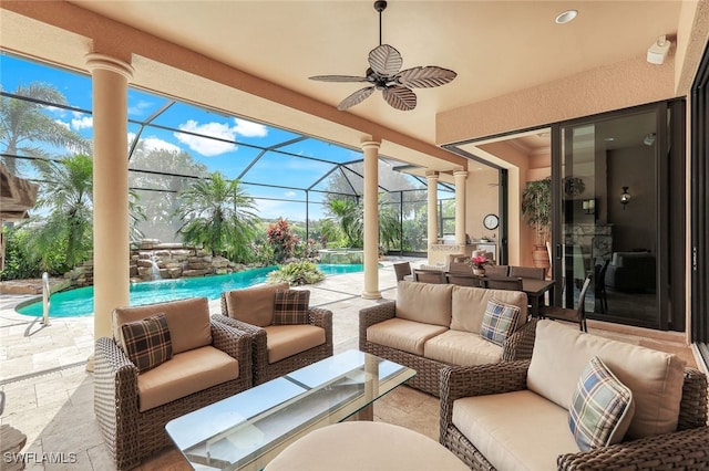 view of patio with an outdoor living space, pool water feature, ceiling fan, and glass enclosure