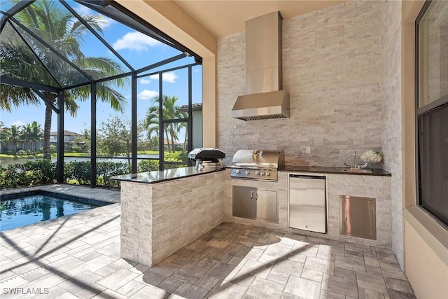 view of patio with grilling area, a lanai, area for grilling, and a sink
