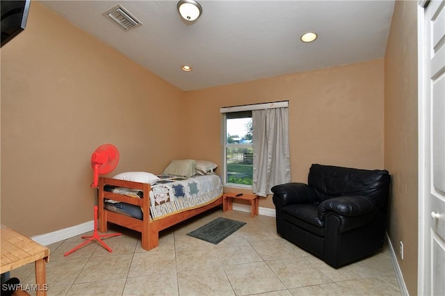 bedroom featuring visible vents, baseboards, and light tile patterned floors