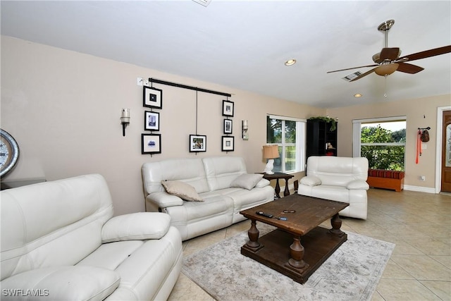 living room with light tile patterned floors, recessed lighting, visible vents, baseboards, and a ceiling fan