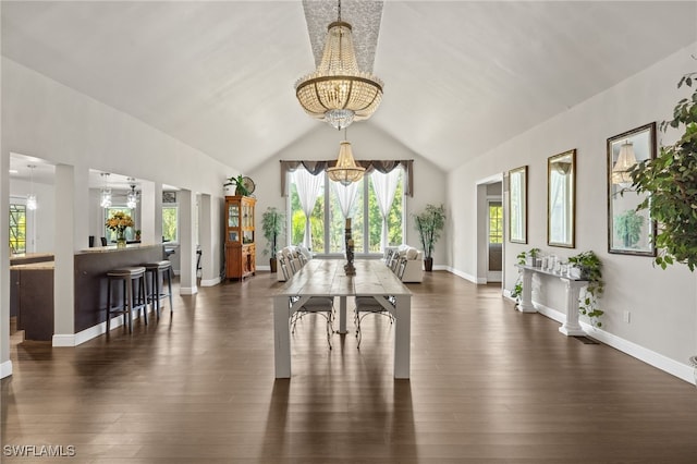 miscellaneous room featuring lofted ceiling, a notable chandelier, and dark hardwood / wood-style flooring