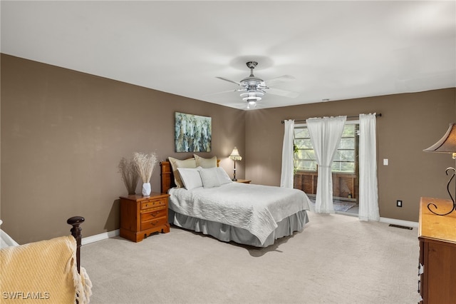 bedroom featuring light colored carpet and ceiling fan