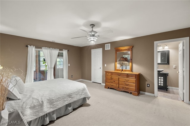 carpeted bedroom featuring access to exterior, connected bathroom, and ceiling fan