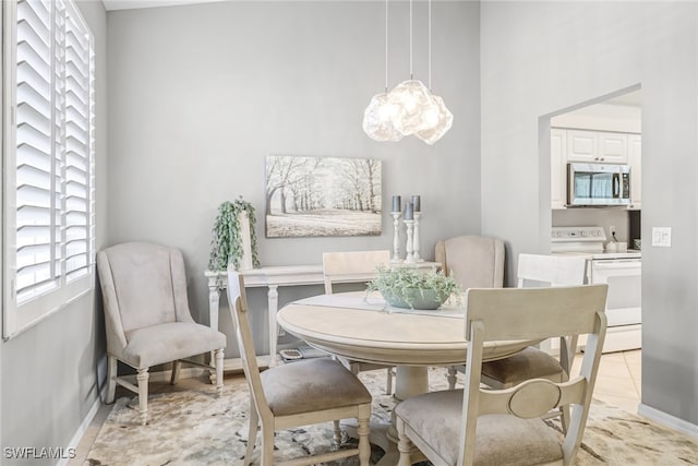 dining area with light tile patterned flooring