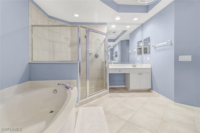 bathroom featuring vanity, independent shower and bath, tile patterned floors, and a raised ceiling