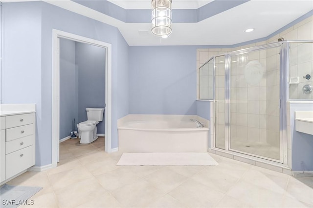 full bathroom featuring toilet, a garden tub, a shower stall, and vanity