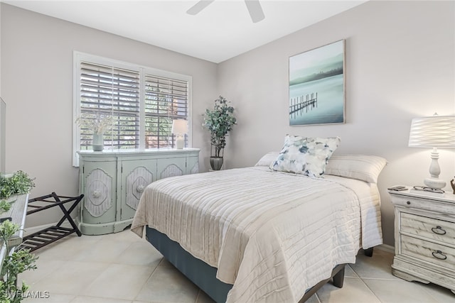 tiled bedroom with ceiling fan