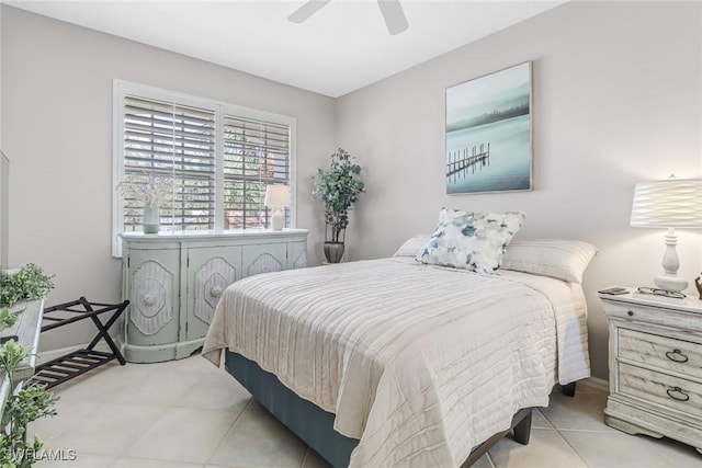 bedroom featuring ceiling fan and light tile patterned flooring