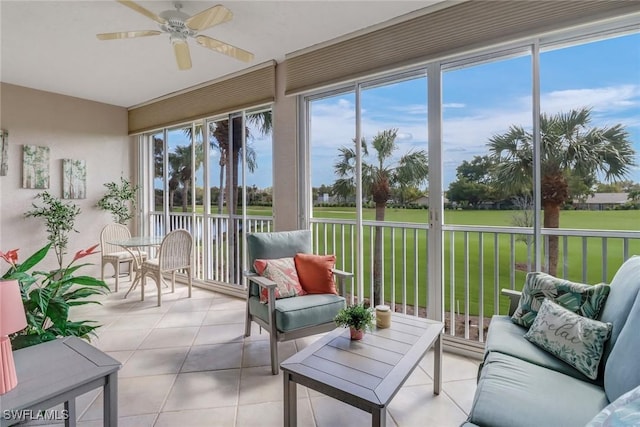 sunroom / solarium featuring outdoor lounge area, ceiling fan, and plenty of natural light