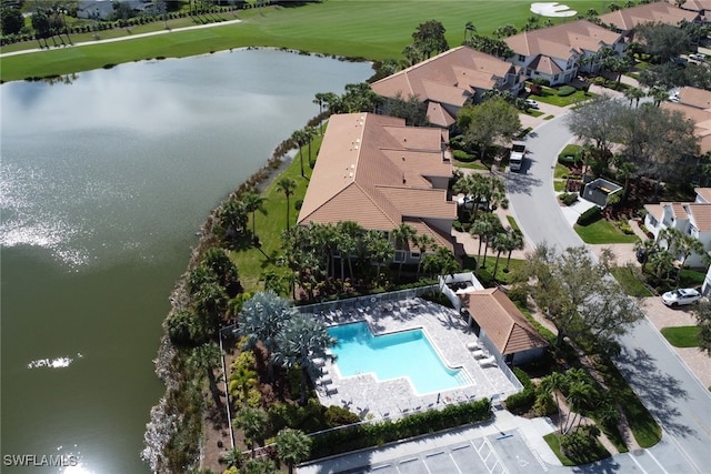 aerial view featuring golf course view and a water view