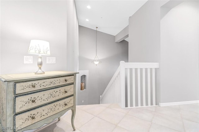 stairway with tile patterned flooring