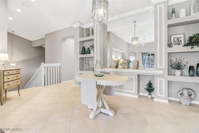 dining space with built in shelves, an inviting chandelier, and tile patterned flooring