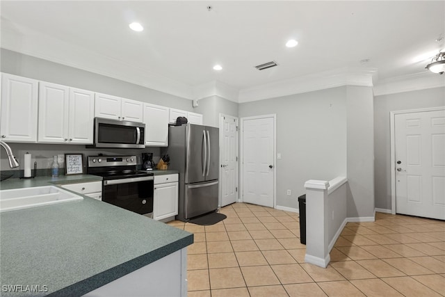 kitchen with sink, white cabinetry, stainless steel appliances, crown molding, and light tile patterned floors