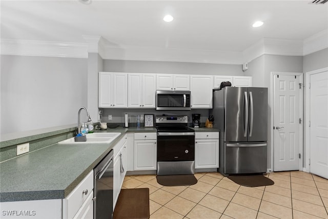 kitchen featuring crown molding, stainless steel appliances, sink, and white cabinets