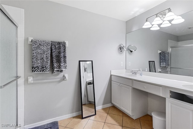 bathroom with vanity, tile patterned floors, and an enclosed shower