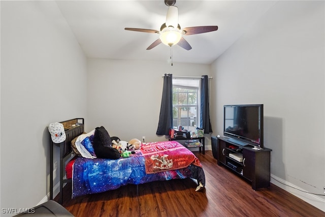 bedroom featuring dark hardwood / wood-style flooring and ceiling fan