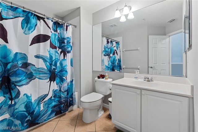 full bathroom featuring vanity, shower / tub combo, toilet, and tile patterned floors