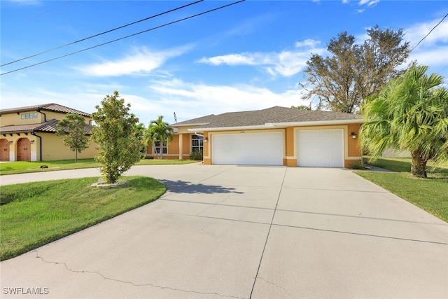 view of front facade featuring a front yard and a garage