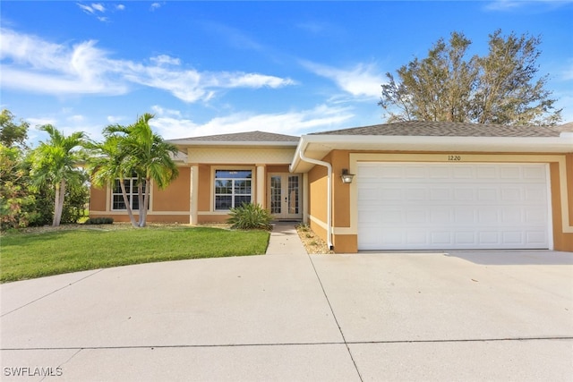 ranch-style home with a front lawn and a garage