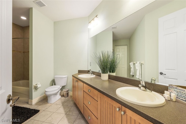 full bathroom with tiled shower / bath, vanity, toilet, and tile patterned flooring