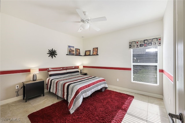 bedroom featuring light tile patterned floors and ceiling fan