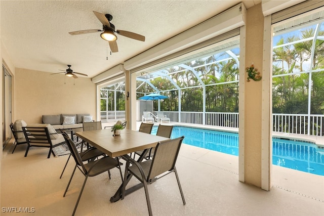 exterior space with a swimming pool and ceiling fan