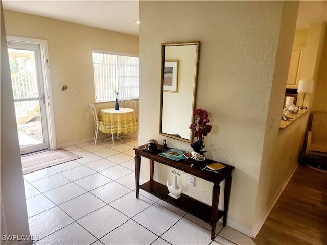 entryway featuring light tile patterned floors