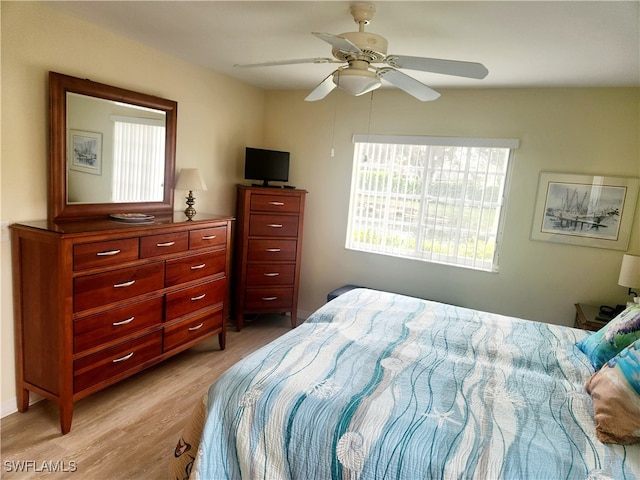 bedroom featuring light hardwood / wood-style floors and ceiling fan