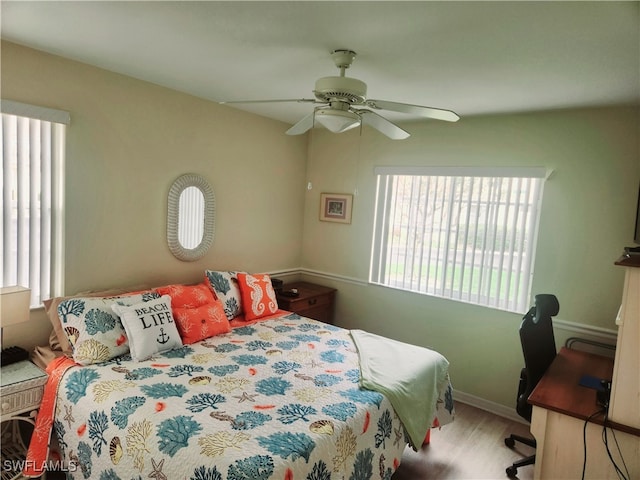 bedroom featuring ceiling fan and light hardwood / wood-style flooring