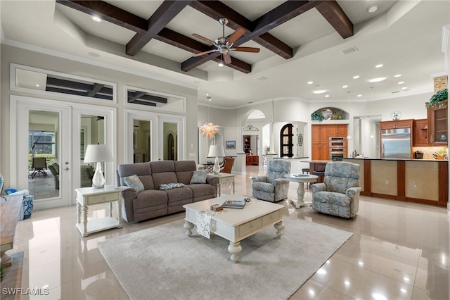 tiled living room featuring french doors, ceiling fan, coffered ceiling, beamed ceiling, and crown molding