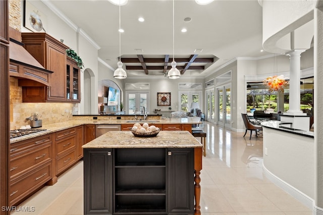 kitchen with a kitchen island, coffered ceiling, kitchen peninsula, decorative columns, and pendant lighting