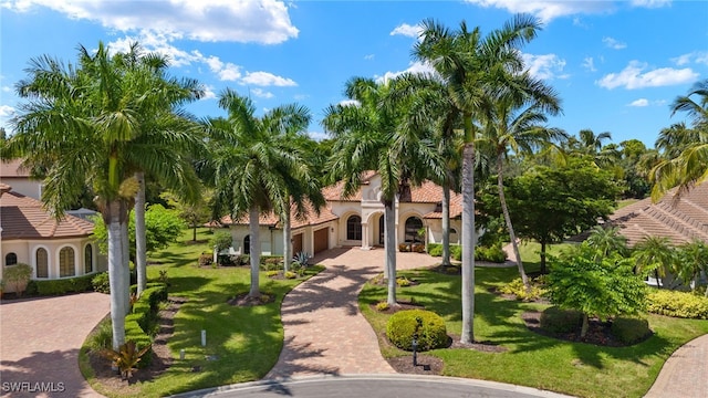 view of property's community with a lawn