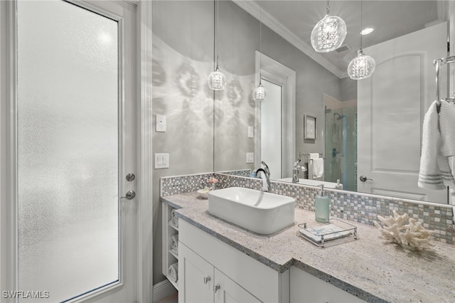 bathroom featuring vanity, walk in shower, ornamental molding, and decorative backsplash