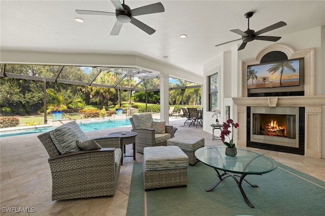 exterior space featuring glass enclosure and ceiling fan