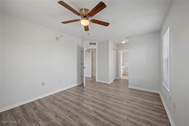 spare room featuring light hardwood / wood-style floors and ceiling fan