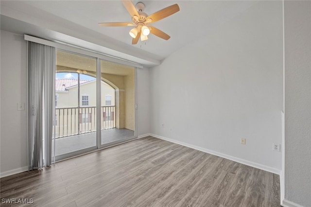 empty room with wood-type flooring and ceiling fan